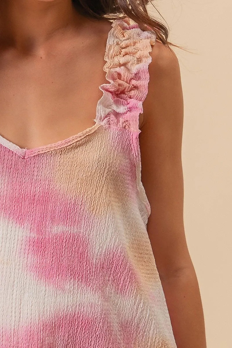 Colorful BiBi tie-dye printed textured woven fabric with ruffled details, showcasing a trendy, vibrant summer garment.