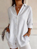Plus size striped button-down long sleeve shirt by Trendsi, featuring a full size fit and classic collar, displayed on a hanger.