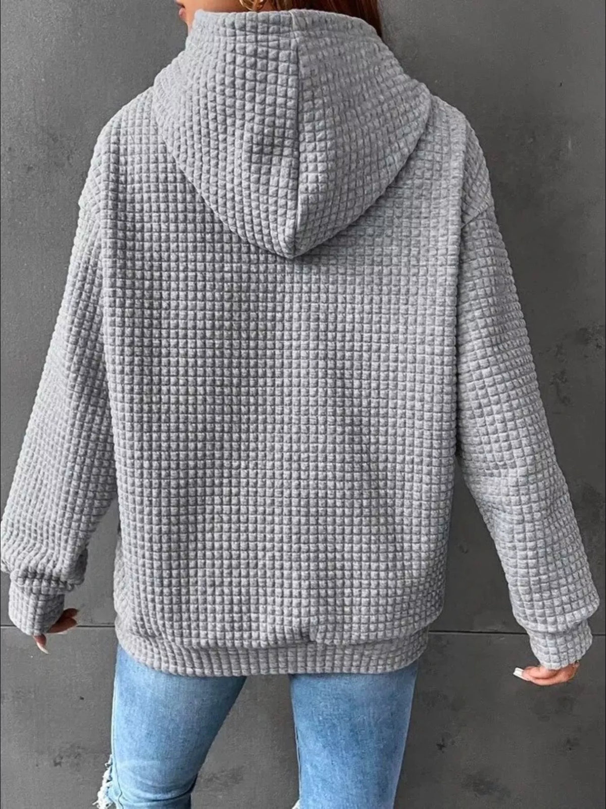 Plus size textured kangaroo pocket hoodie by Trendsi featuring a full-size design and cozy fabric, ideal for casual wear.