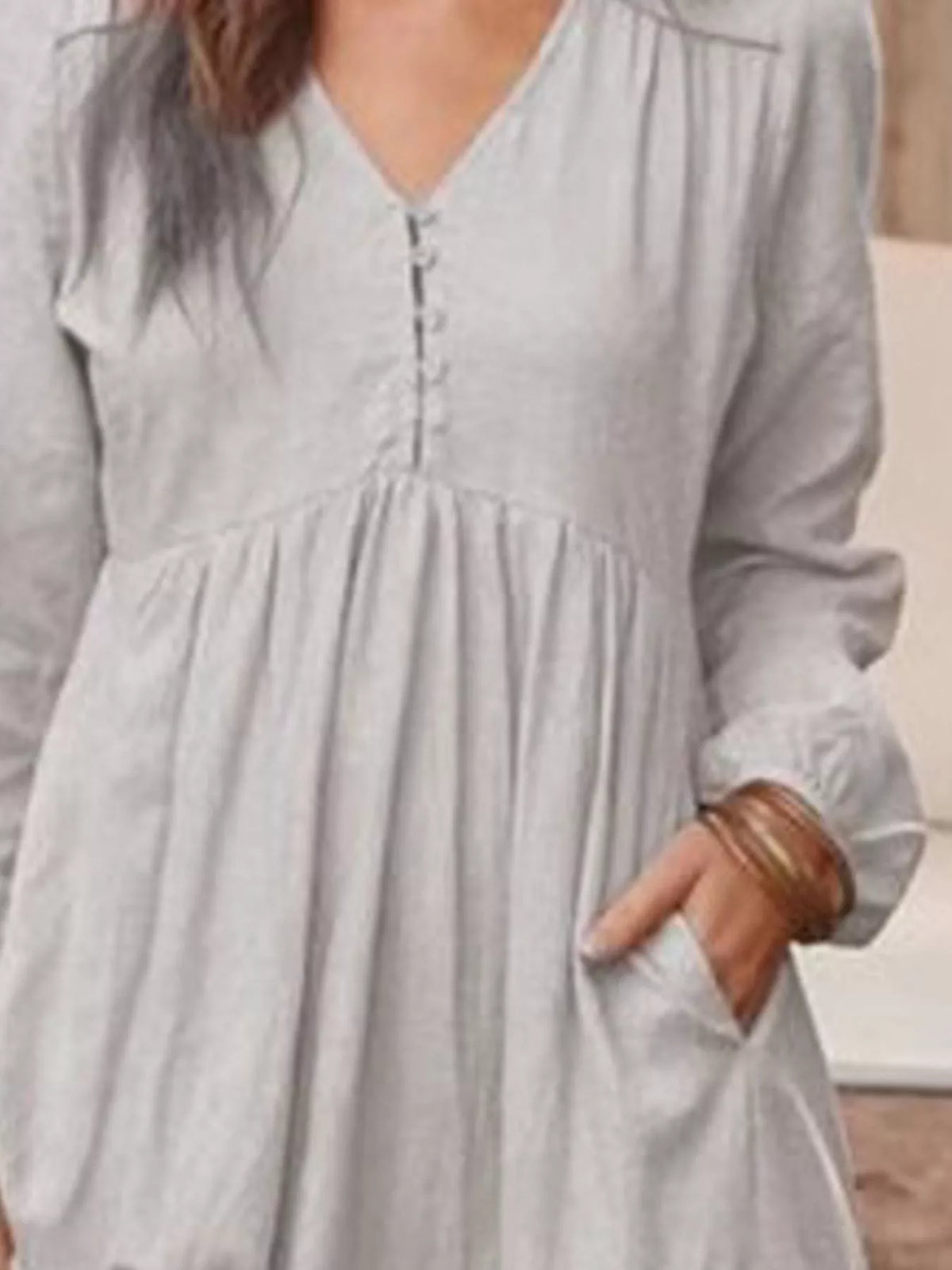 Full size V-neck long sleeve tiered maxi dress with pockets by Trendsi, featuring a flowing silhouette and plus size fit.