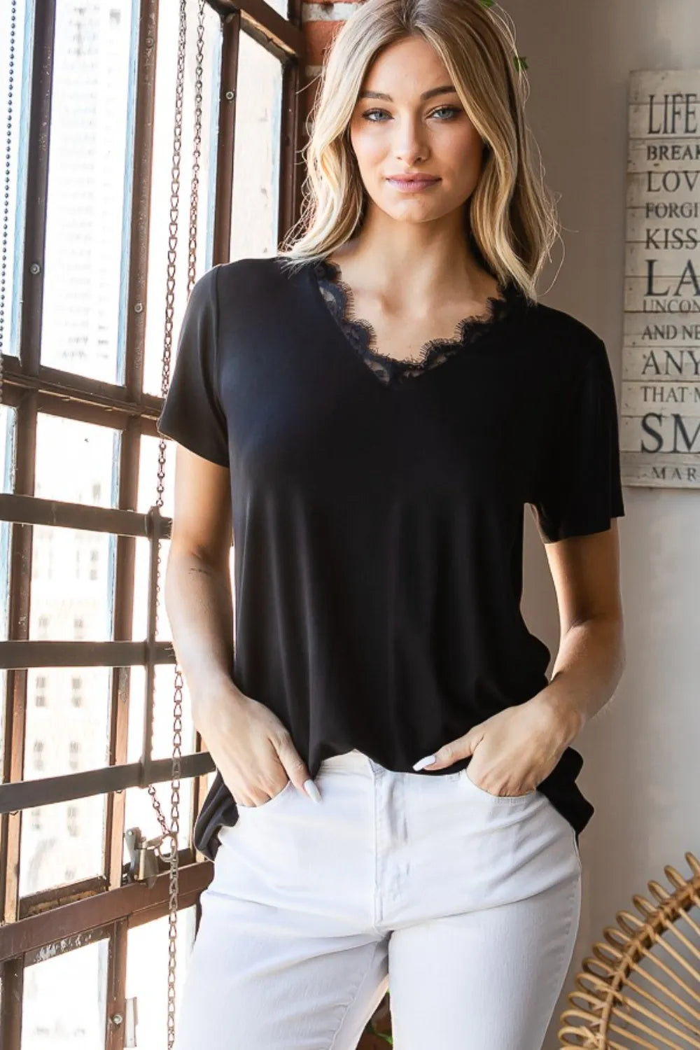 Heimish lace detail v-neck short sleeve t-shirt from Trendsi, featuring a feminine lace accents and casual fit in soft fabric.
