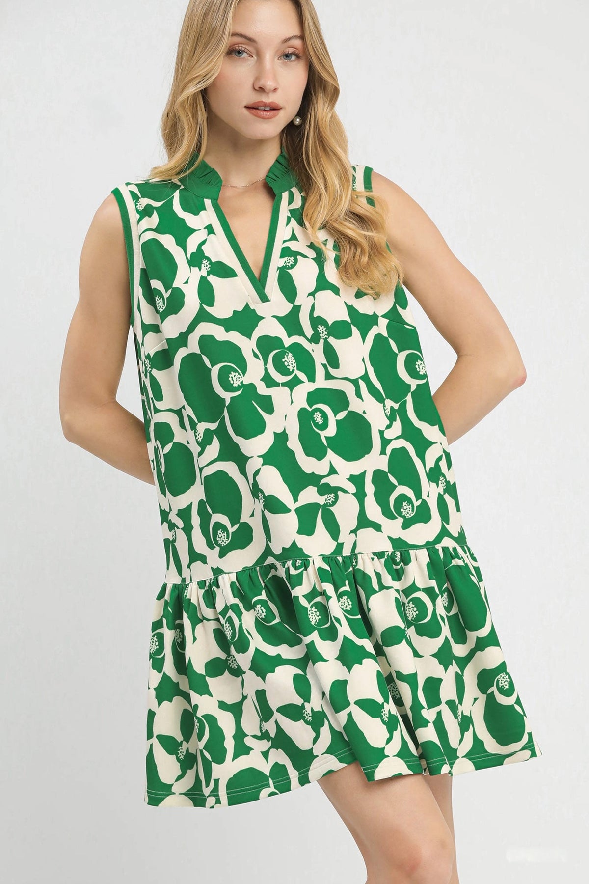 Umgee floral sleeveless tiered dress with a flowy silhouette and vibrant floral pattern, perfect for summer wear.