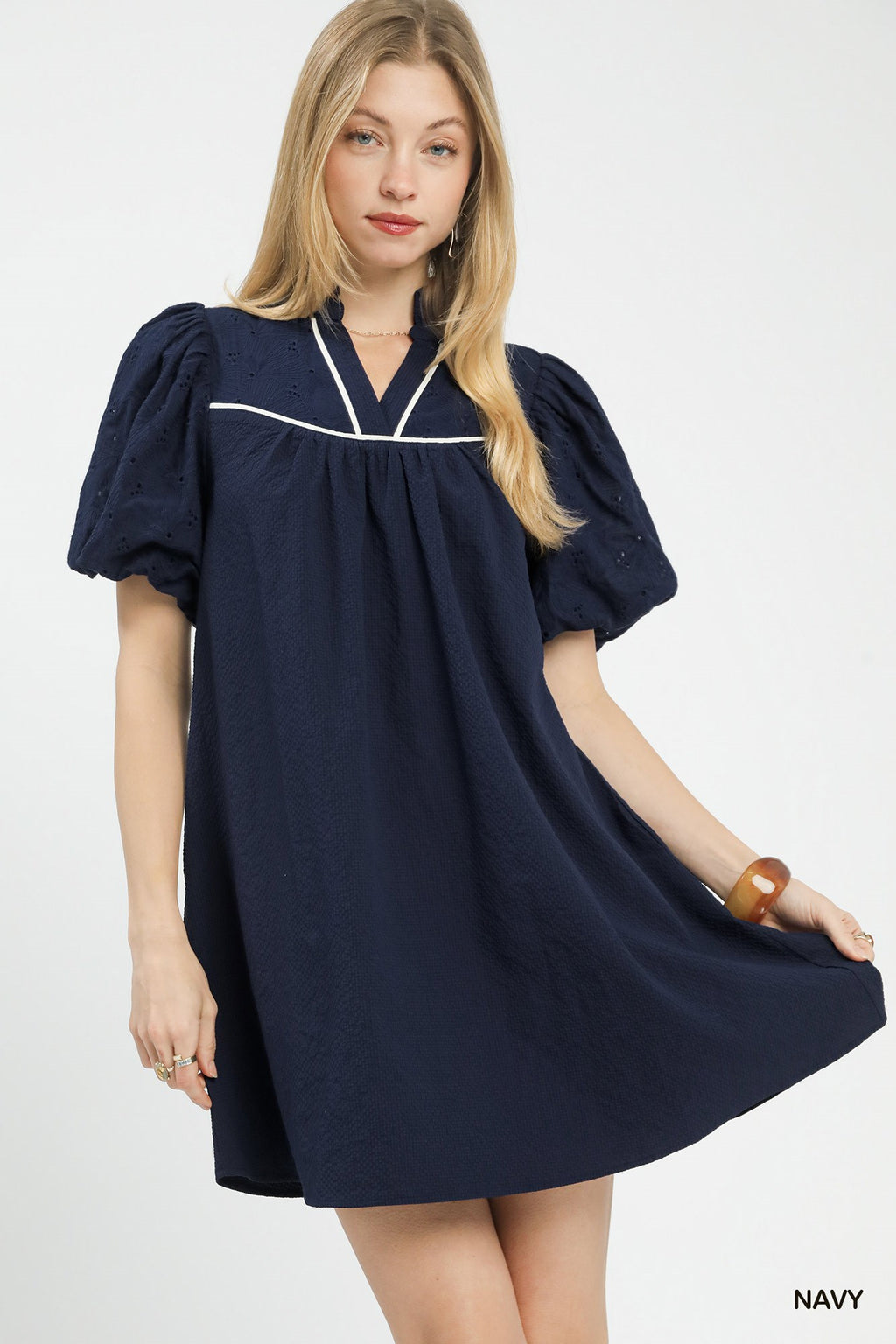 Umgee puff sleeve textured babydoll dress with a relaxed fit and feminine silhouette, perfect for casual or dressy occasions.