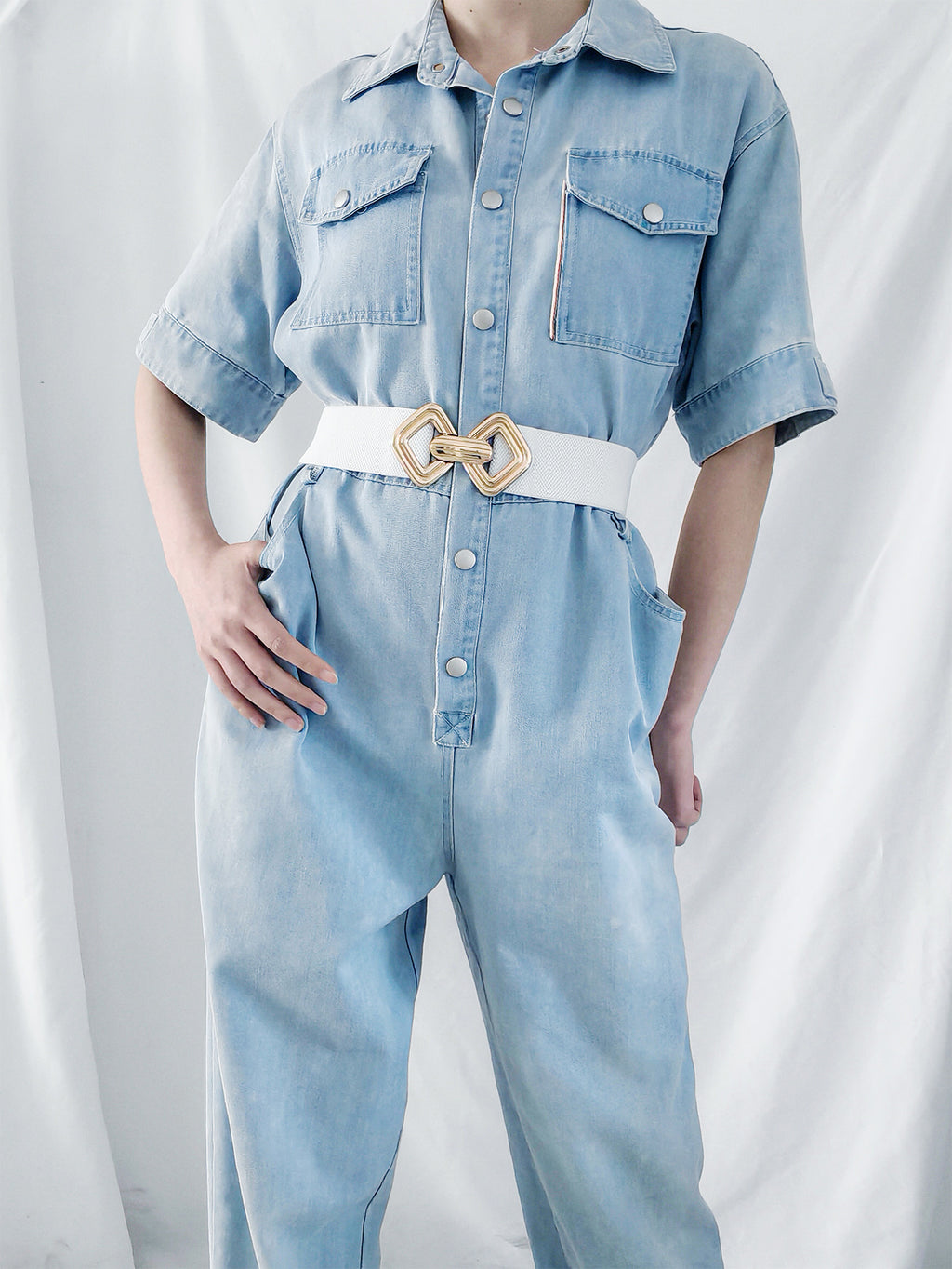 Geometric buckle elastic wide belt with black and gold design, fashion accessory from Trendsi.