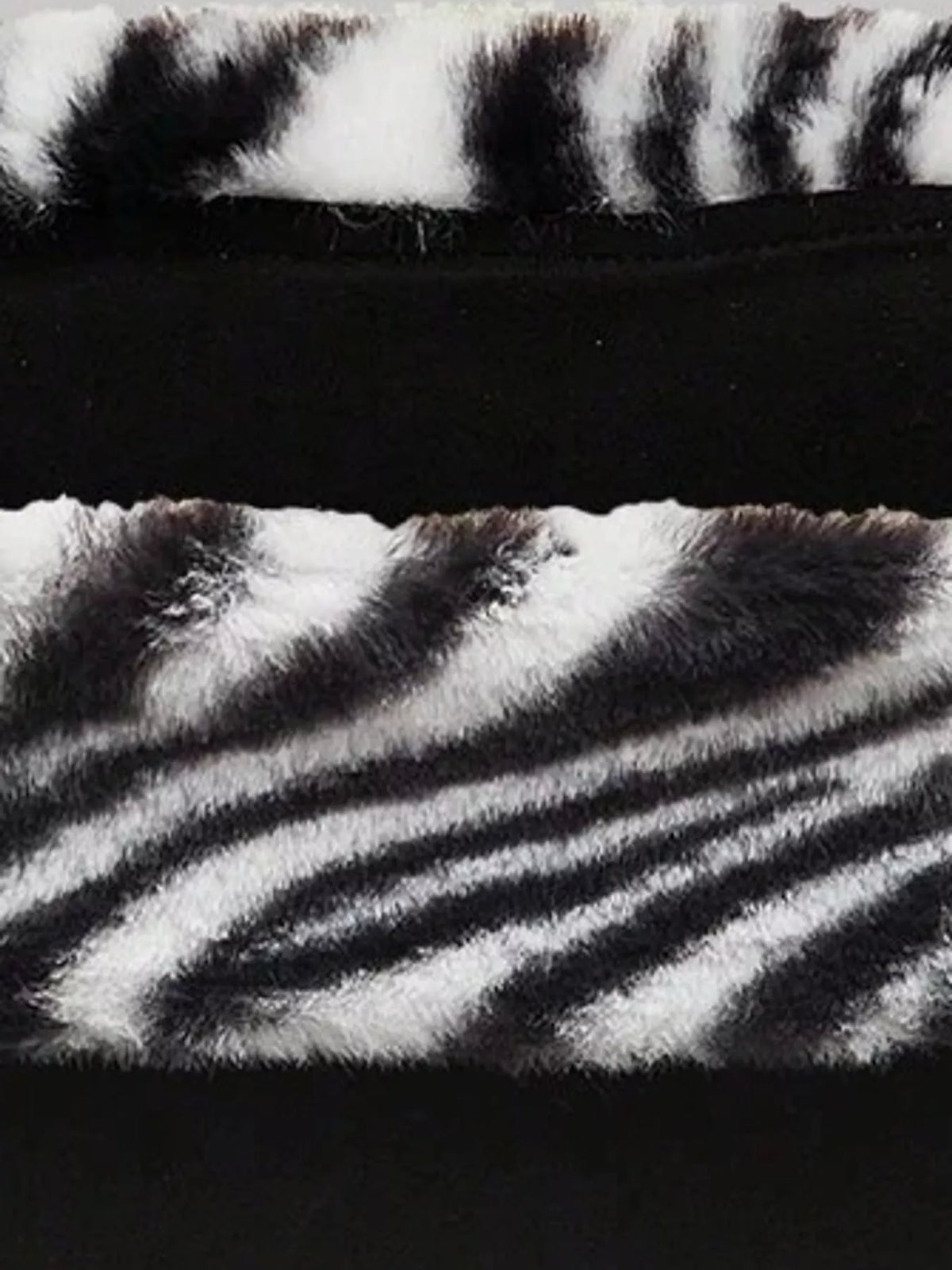 Zebra print faux fur trimmed tube top from Trendsi, featuring bold black and white zebra pattern and soft fur accents.