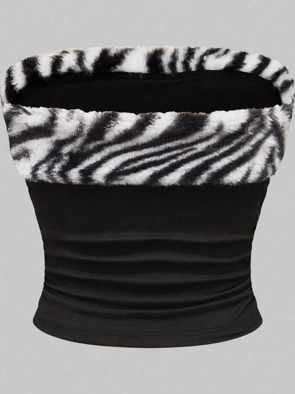 Zebra print faux fur trimmed tube top by Trendsi, featuring black and white zebra pattern with soft faux fur accents.