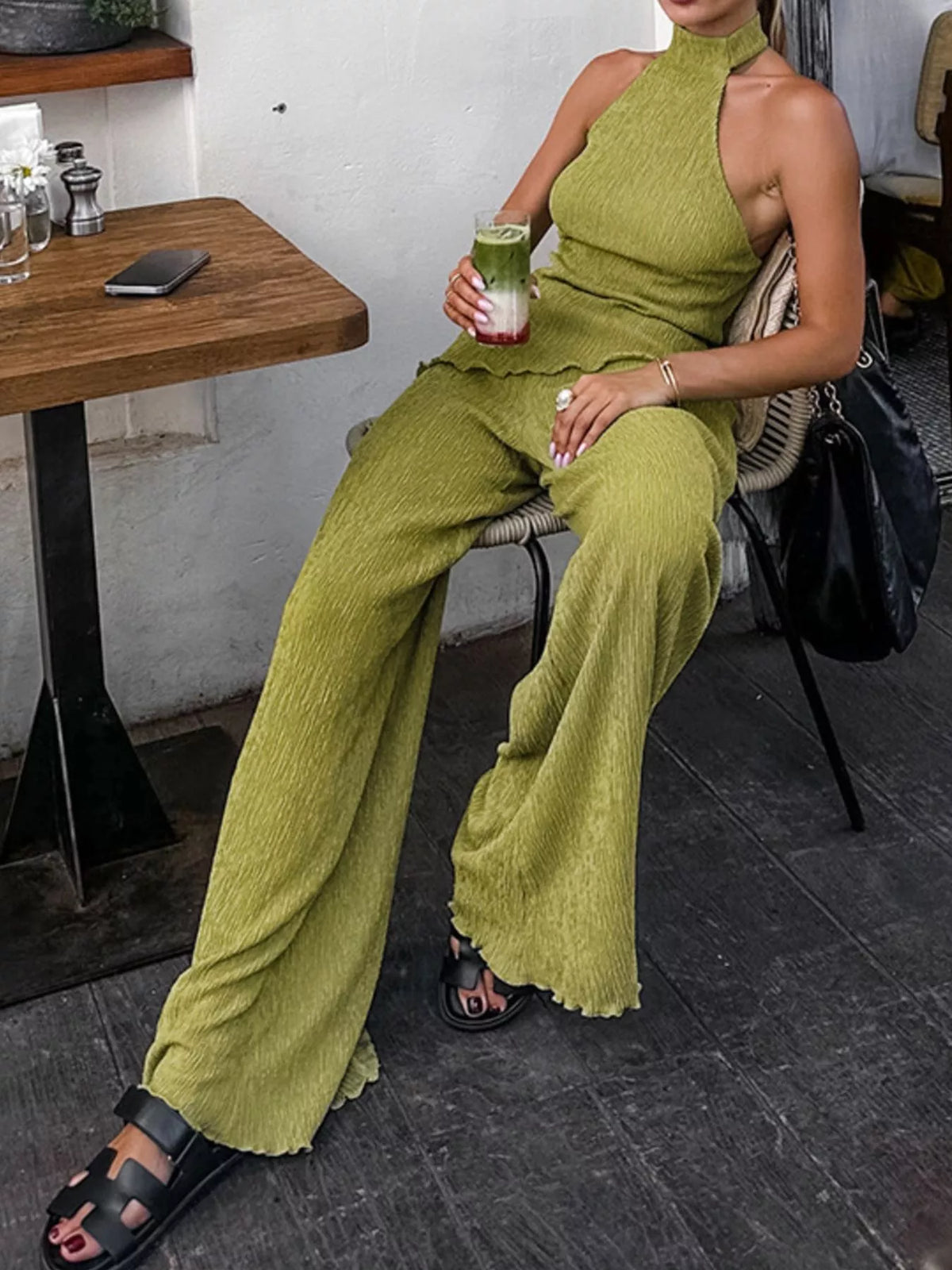 Trendsi sleeveless top and wide-leg pants two-piece set displayed on a model, stylish casual outfit for warm weather.