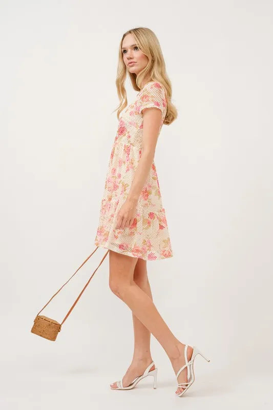 Square neck tiered floral fishnet dress by Trendsi featuring a flowy, layered design with floral patterns and fishnet fabric.