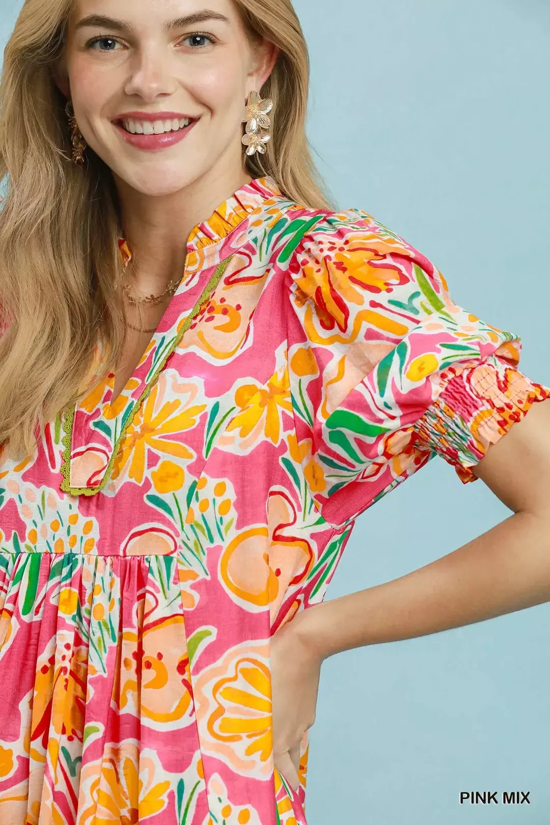 Umgee floral print puff sleeve tiered midi dress with a flowy silhouette and vibrant floral pattern, perfect for spring and summer.