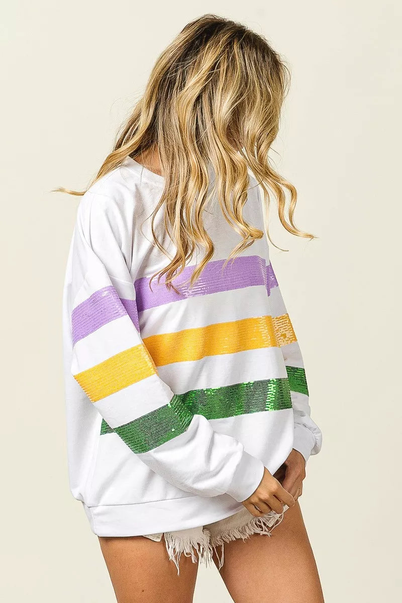 BiBi Sequin Mardi Gras striped round neck sweatshirt by Trendsi featuring colorful sequins and a casual, festive style.