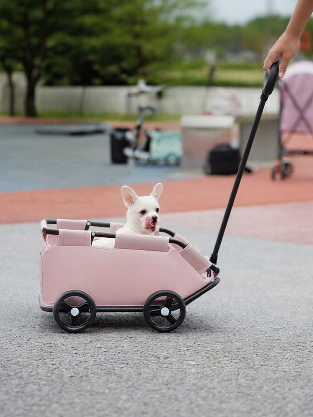 Portable folding pet stroller wagon by Trendsi, compact design with mesh sides and handle for easy pet transport.