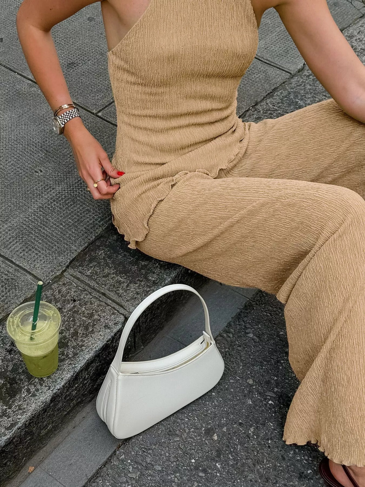 Trendsi sleeveless top and wide-leg pants two-piece set, stylish and casual outfit, shown in a flat lay with neutral tones.