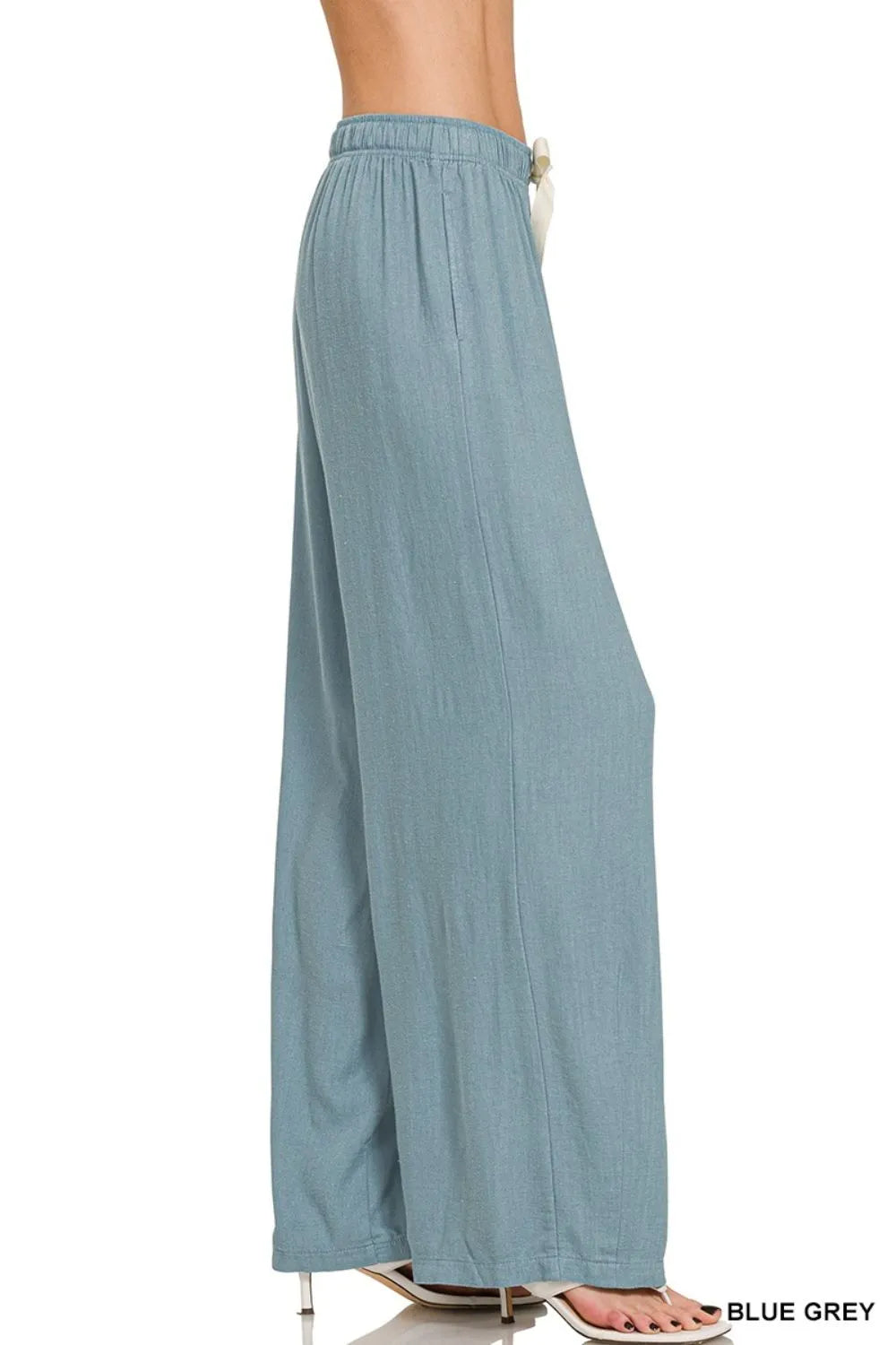 Light beige Zenana linen drawstring pants with elastic waistband and relaxed fit, perfect for casual summer wear.