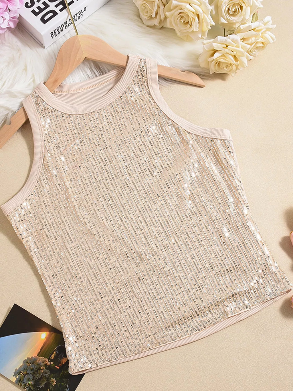 Sequin round neck tank top in black featuring shiny sequins and sleeveless design, from Trendsi.