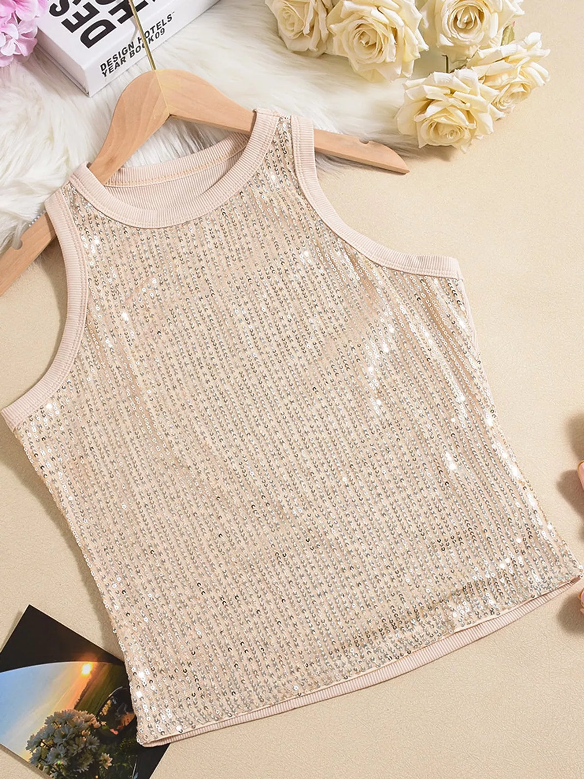 Sequin round neck tank top in black featuring shiny sequins and sleeveless design, from Trendsi.