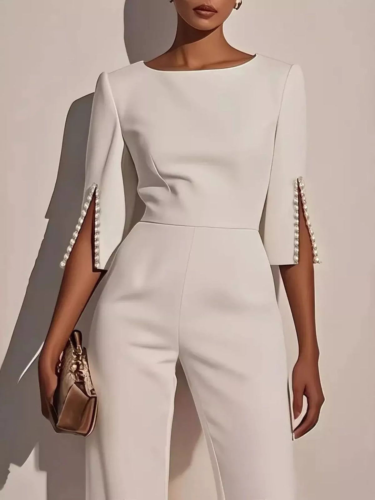 Wide-leg jumpsuit with slit sleeves from Trendsi, featuring flowing fabric and stylish design, displayed on a hanger.