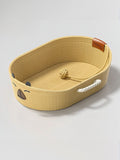 Woven Rope Oval Pet Bed by Trendsi with soft cushion inside, perfect for small dogs or cats, in natural woven design.