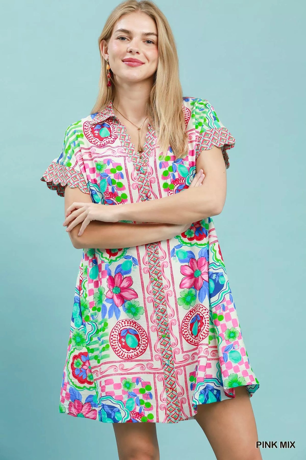 Umgee Mediterranean print dress with contrast printed trim, featuring a flowy silhouette and vibrant, intricate patterns.