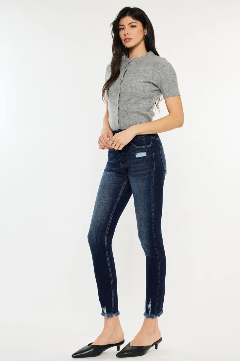 Kancan high waist jeans with raw hem and whisker details, featuring a full size fit, styled with trendy casual fashion.