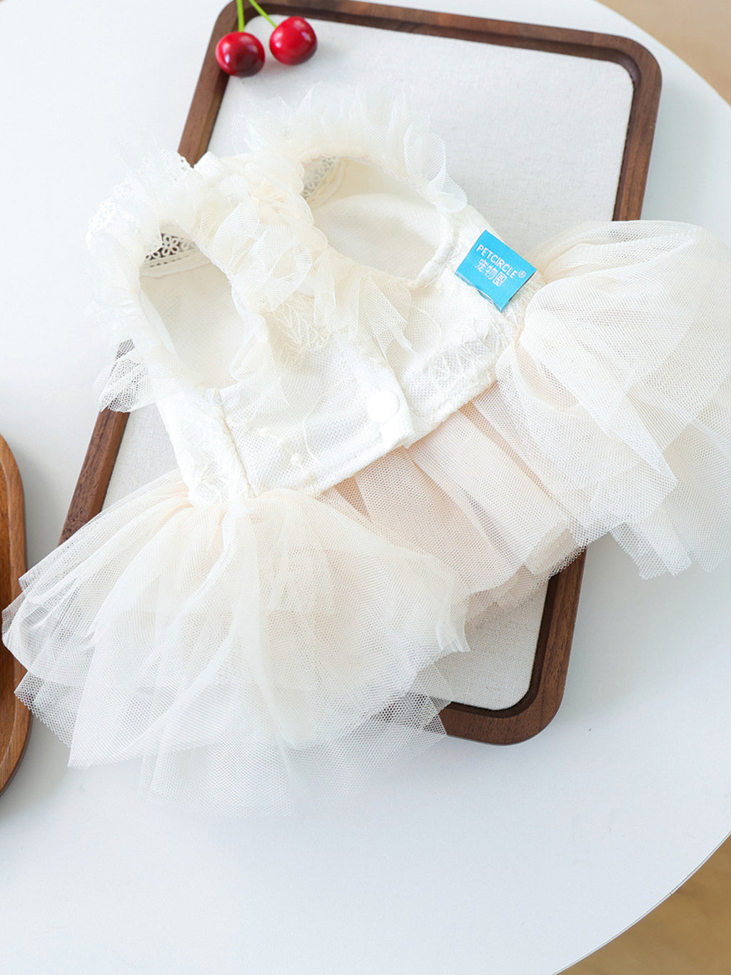 Cute pet dress with tulle ruffles and bow from Trendsi, featuring a stylish design for small dogs or pets.