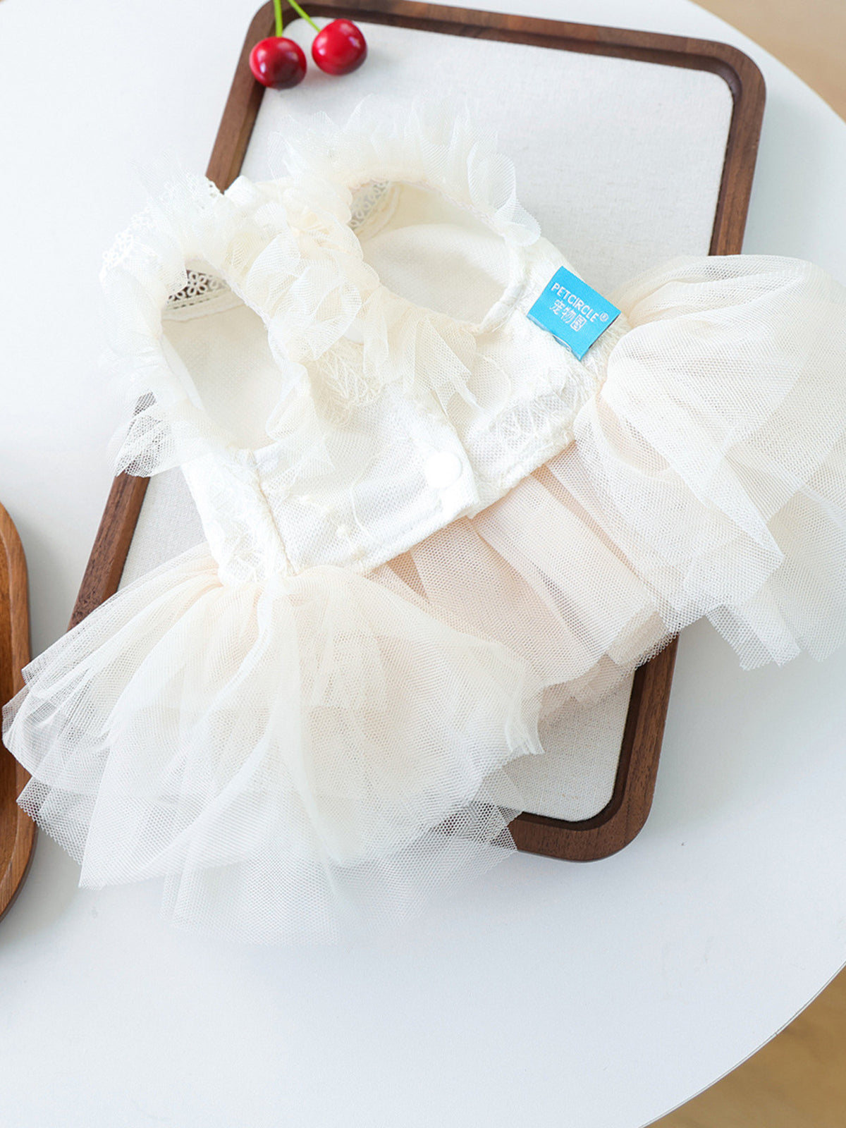 Cute pet dress with tulle ruffles and bow from Trendsi, featuring a stylish design for small dogs or pets.