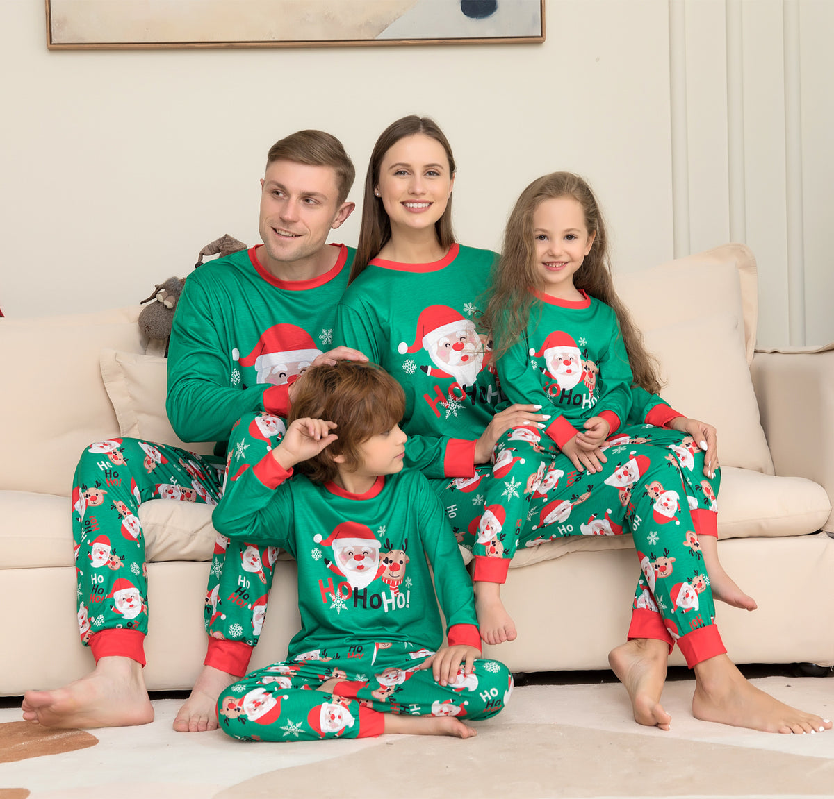 Green matching family Christmas pajamas with Santa print