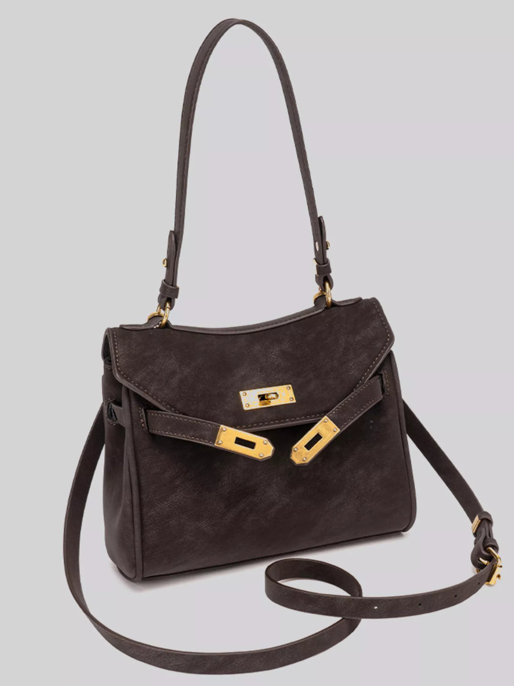 Gold-tone hardware crossbody bag with sleek design and adjustable strap, featuring trendy hardware accents.
