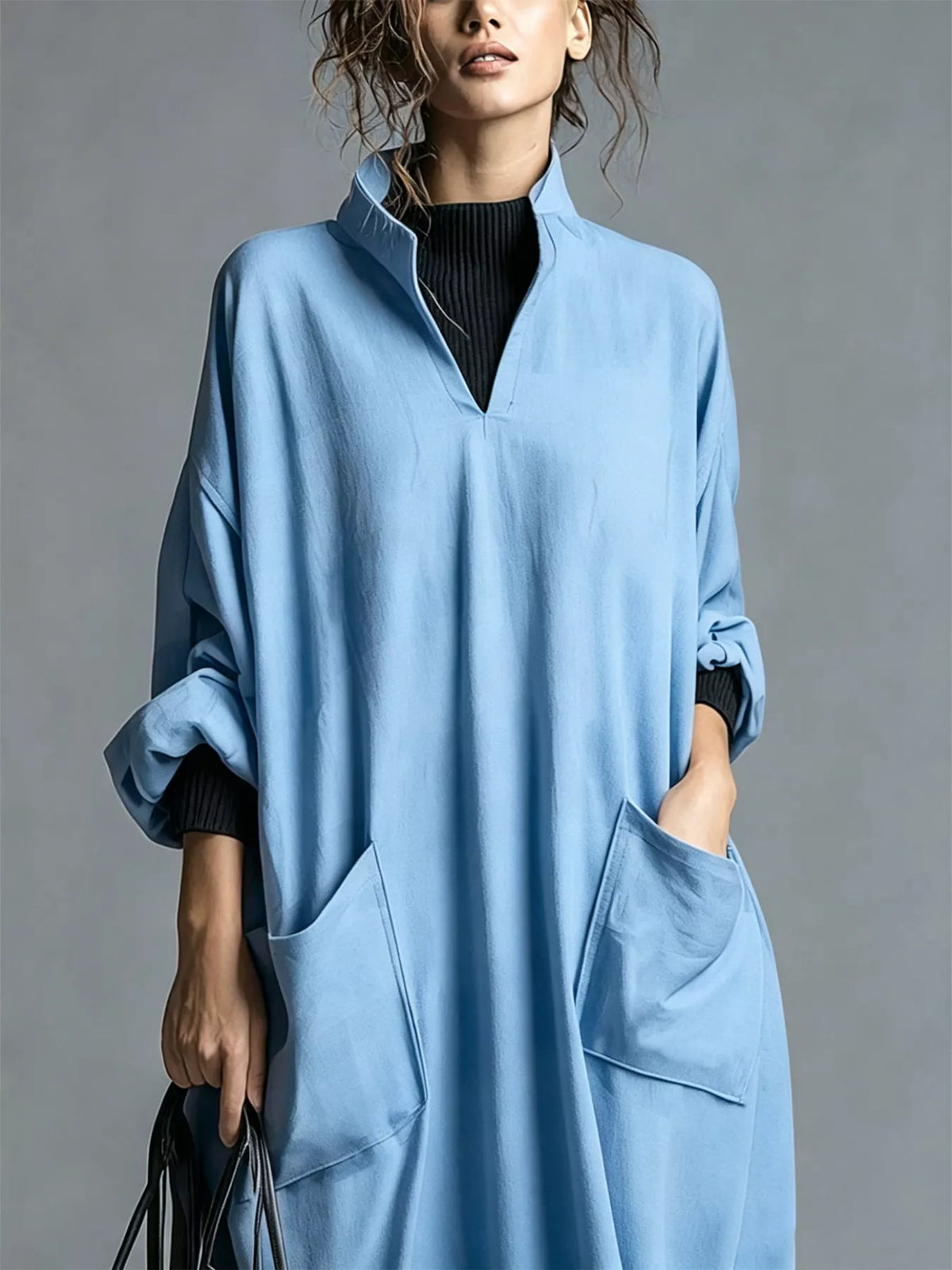 Plus size loose-fit mock neck midi dress with pockets by Trendsi, shown in a full-length view.
