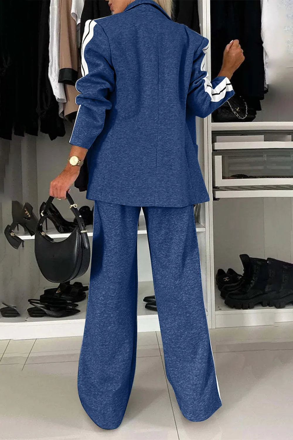 Full size contrast lapel collar top and pants set by Trendsi, featuring a stylish coordinated outfit with a lapel collar and matching pants.