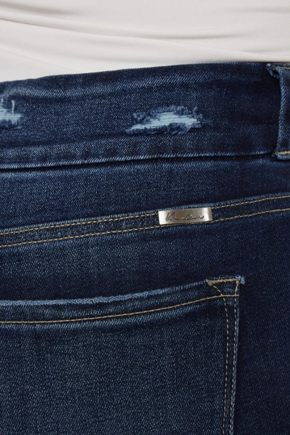 Kancan high waist jeans with raw hem and cat's whiskers design, featuring a full-size fit and trendy denim style.