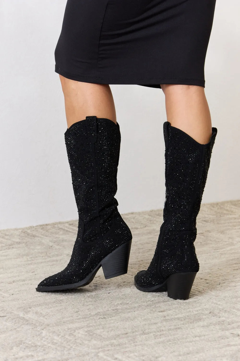Forever Link rhinestone knee-high cowboy boots with Western style, featuring sparkling rhinestones and pointed toes.