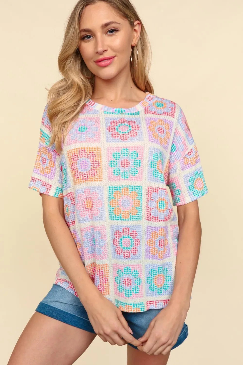 Haptics Flower Print Round Neck Short Sleeve T-Shirt by Trendsi, featuring vibrant floral design on soft fabric.