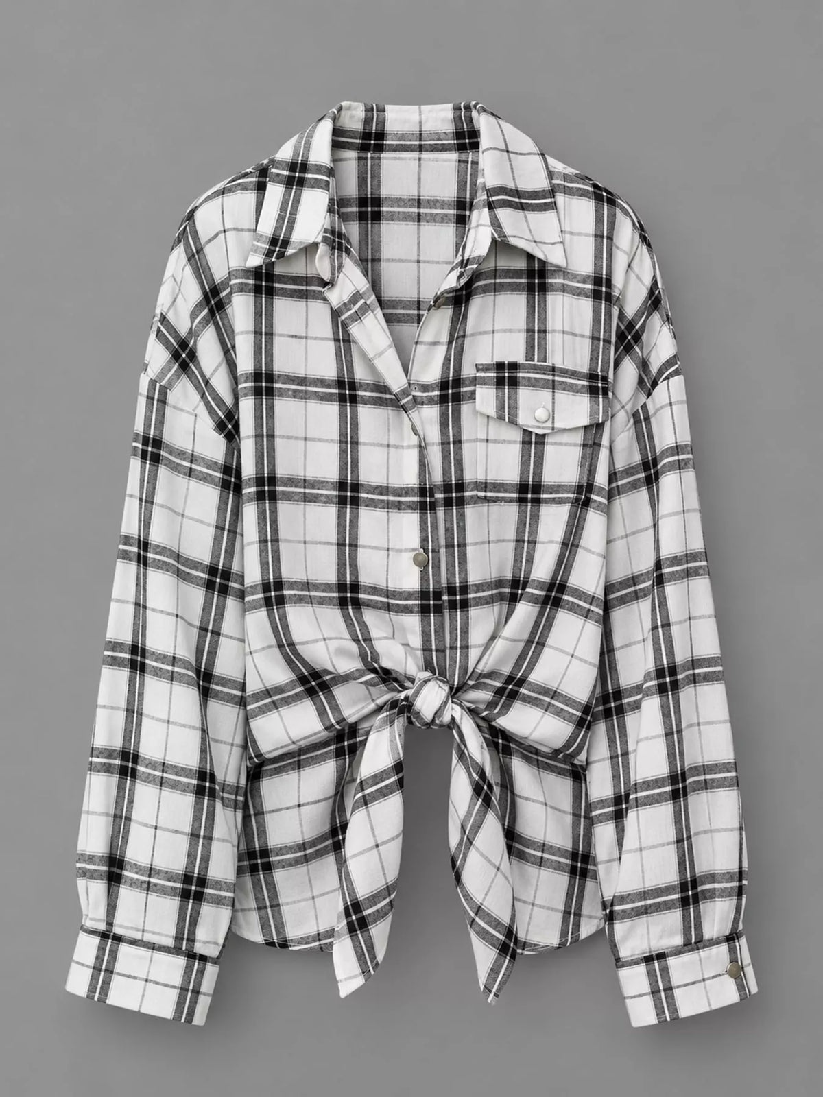 Trendsi plaid button-up shirt featuring a classic checkered pattern in red, black, and white, with a collar and button front.