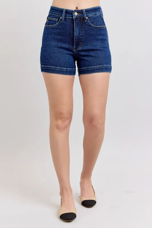 Plus size Judy Blue high waist tummy control denim shorts with a full-length view, showcasing stylish fit and classic denim texture.