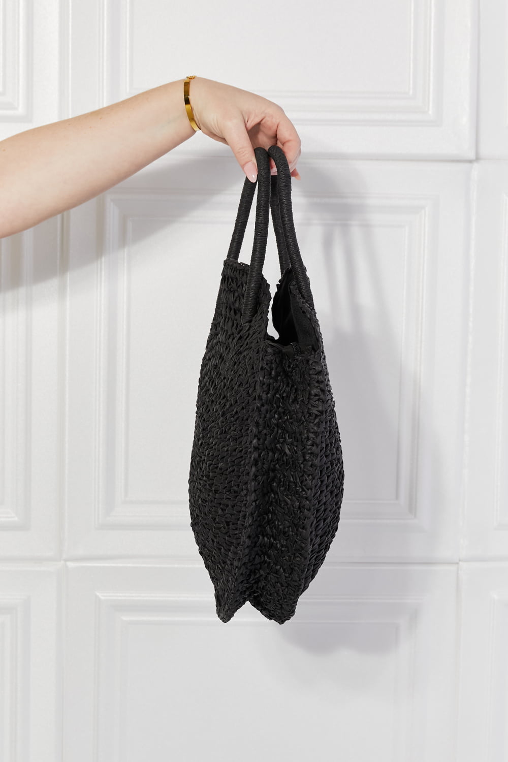 Justin Taylor Beach Date straw rattan handbag in black, stylish and compact with woven rattan design for summer outings