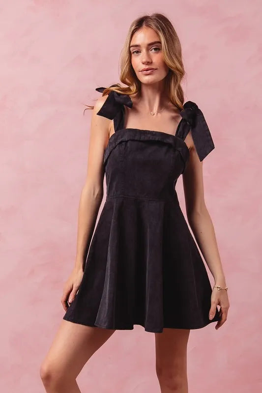 Washed fit and flare Gameday Dress by Trendsi featuring a casual, stylish design with a flared skirt and comfortable fit.