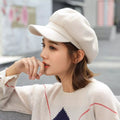 Solid color classic beret by Trendsi, featuring soft fabric and stylish, timeless design for a chic winter accessory.