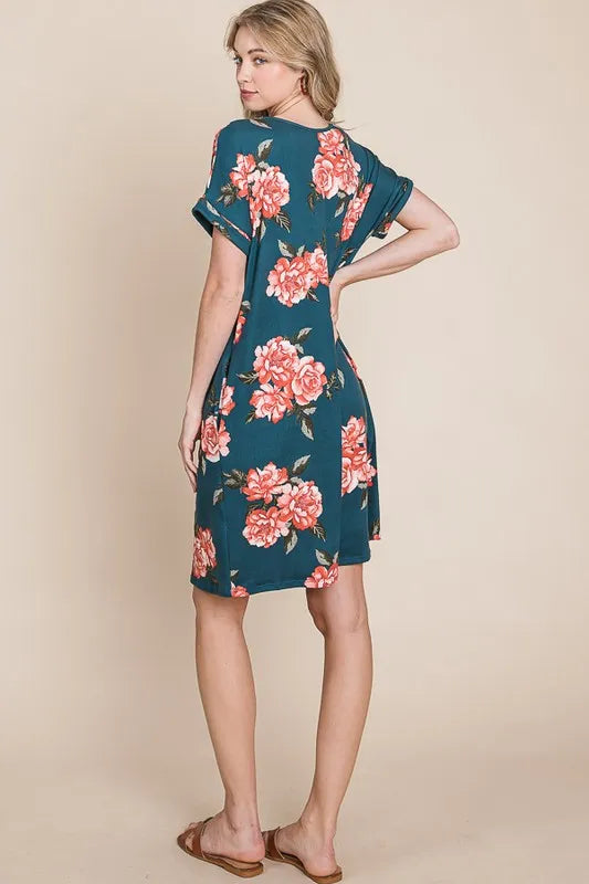 Trendsi BOMBOM floral round neck short tee dress with pockets, featuring a vibrant floral pattern and casual fit.