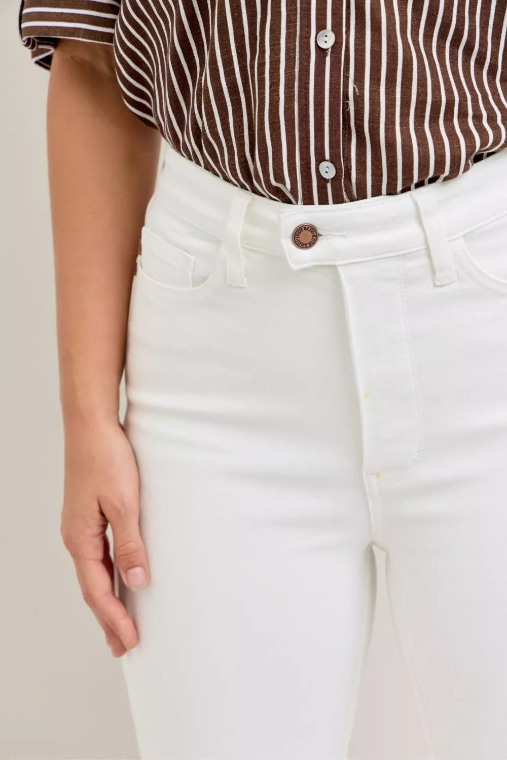 Judy Blue high waist extended waistband capri pants with spade pockets, casual denim style, in a light wash denim fabric.