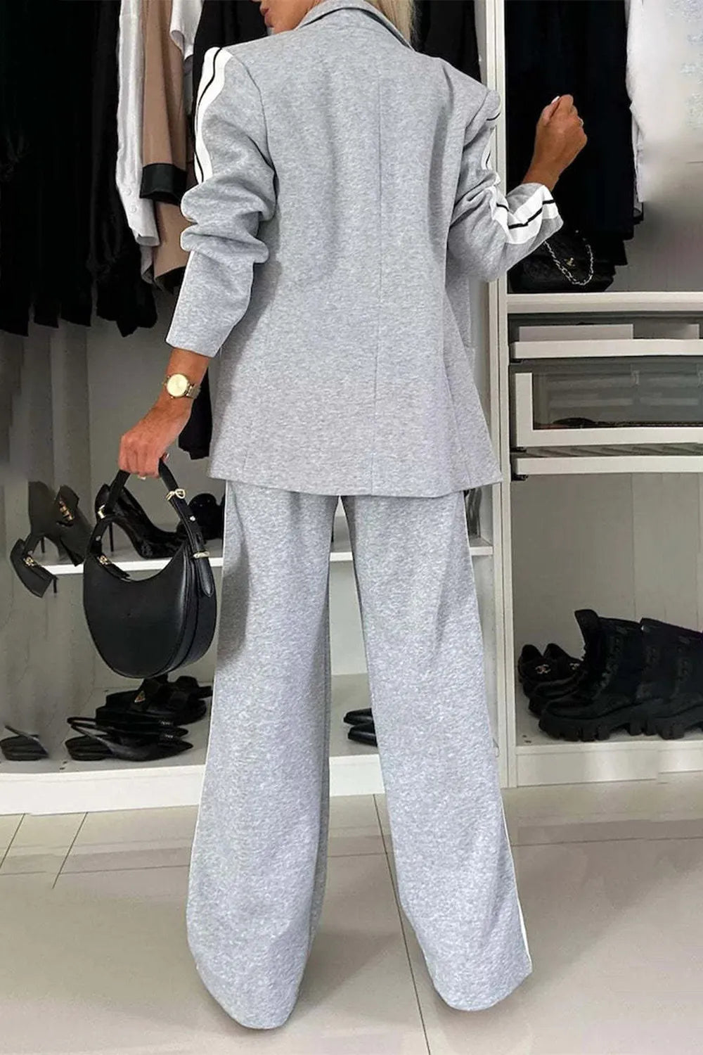 Full size contrast lapel collar top and pants set by Trendsi, featuring a stylish tailored look with matching separates.