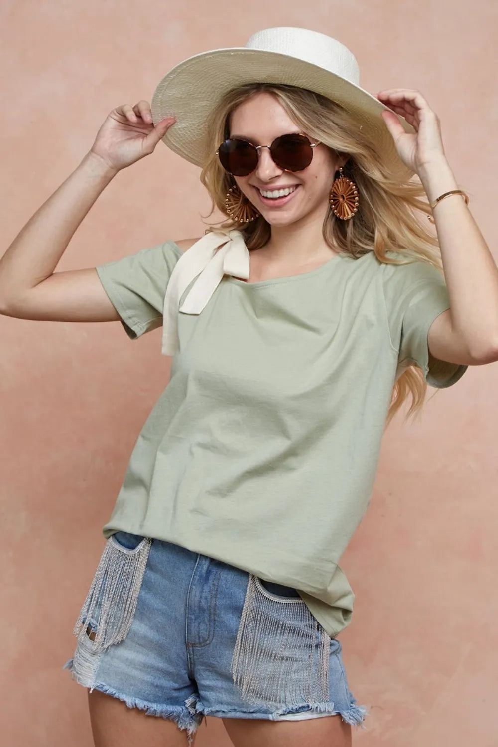 Trendsi BiBi Tied Ribbon One Shoulder Short Sleeve T-Shirt displayed on a model, featuring a stylish tied ribbon detail on one shoulder.