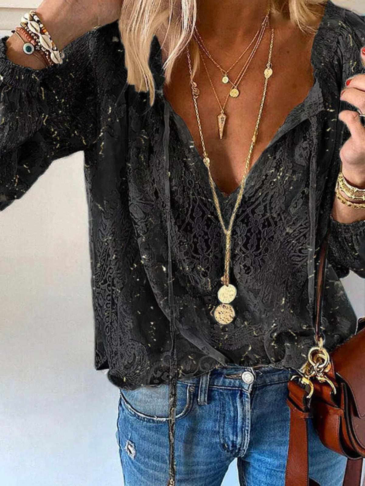 Lace tie-neck blouse from Trendsi with long sleeves, intricate lace details, and a feminine, elegant design.