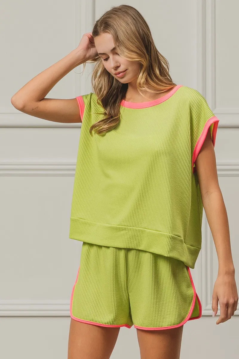 BiBi Cord Rib Knit Contrast Banded Top by Trendsi featuring a ribbed texture and contrasting bands at the hem.