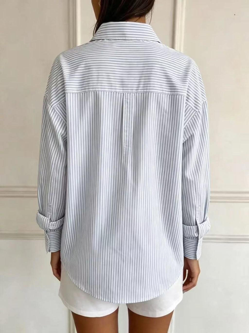 Plus size striped button-down long sleeve shirt from Trendsi, featuring a full-length design and classic collar.