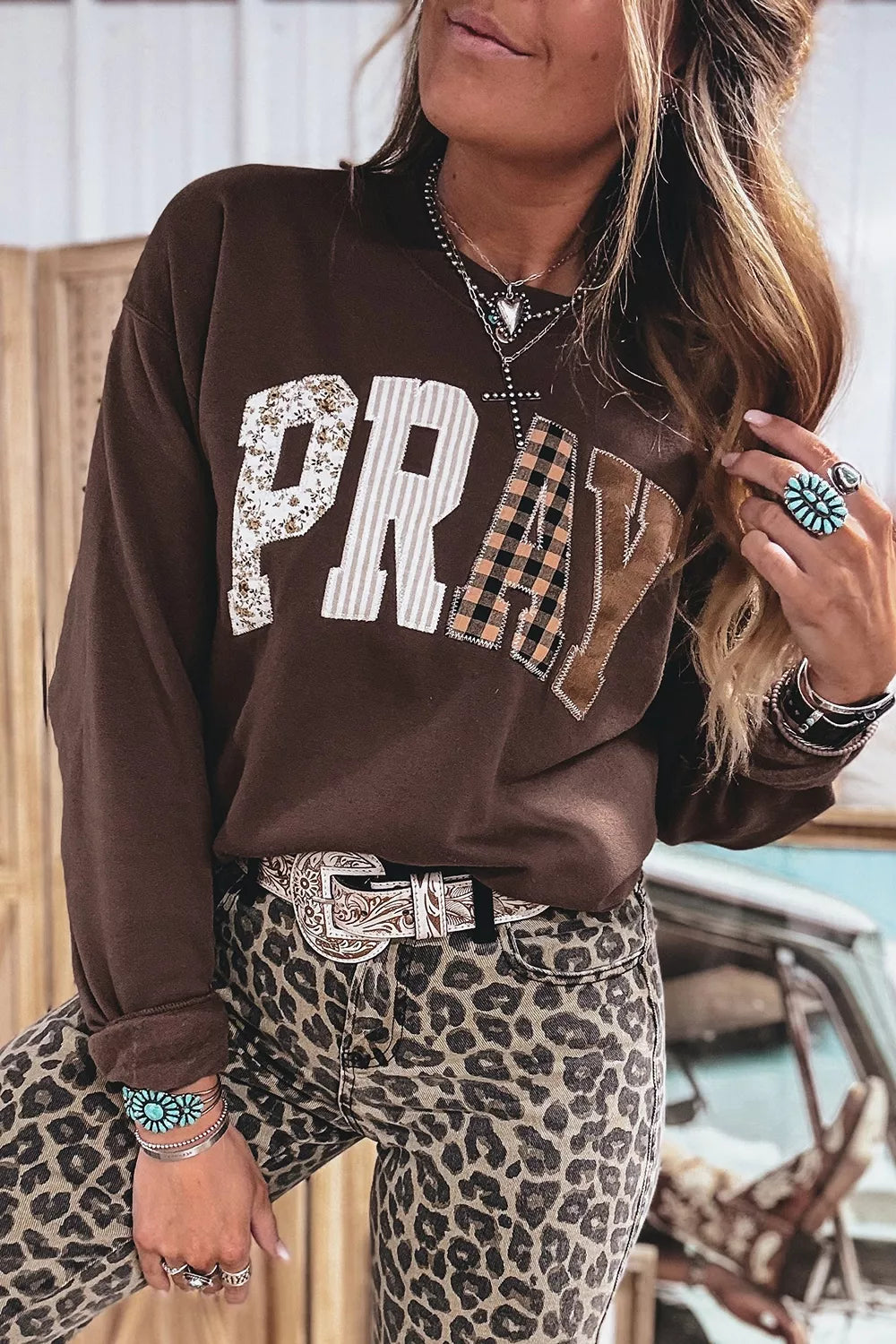 Dark brown crewneck sweatshirt with plaid PRAY graphic, view 6
