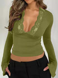 Lace trim V-neck long sleeve slim fit T-shirt by Trendsi, shown in black with lace detail at the neckline and fitted style.