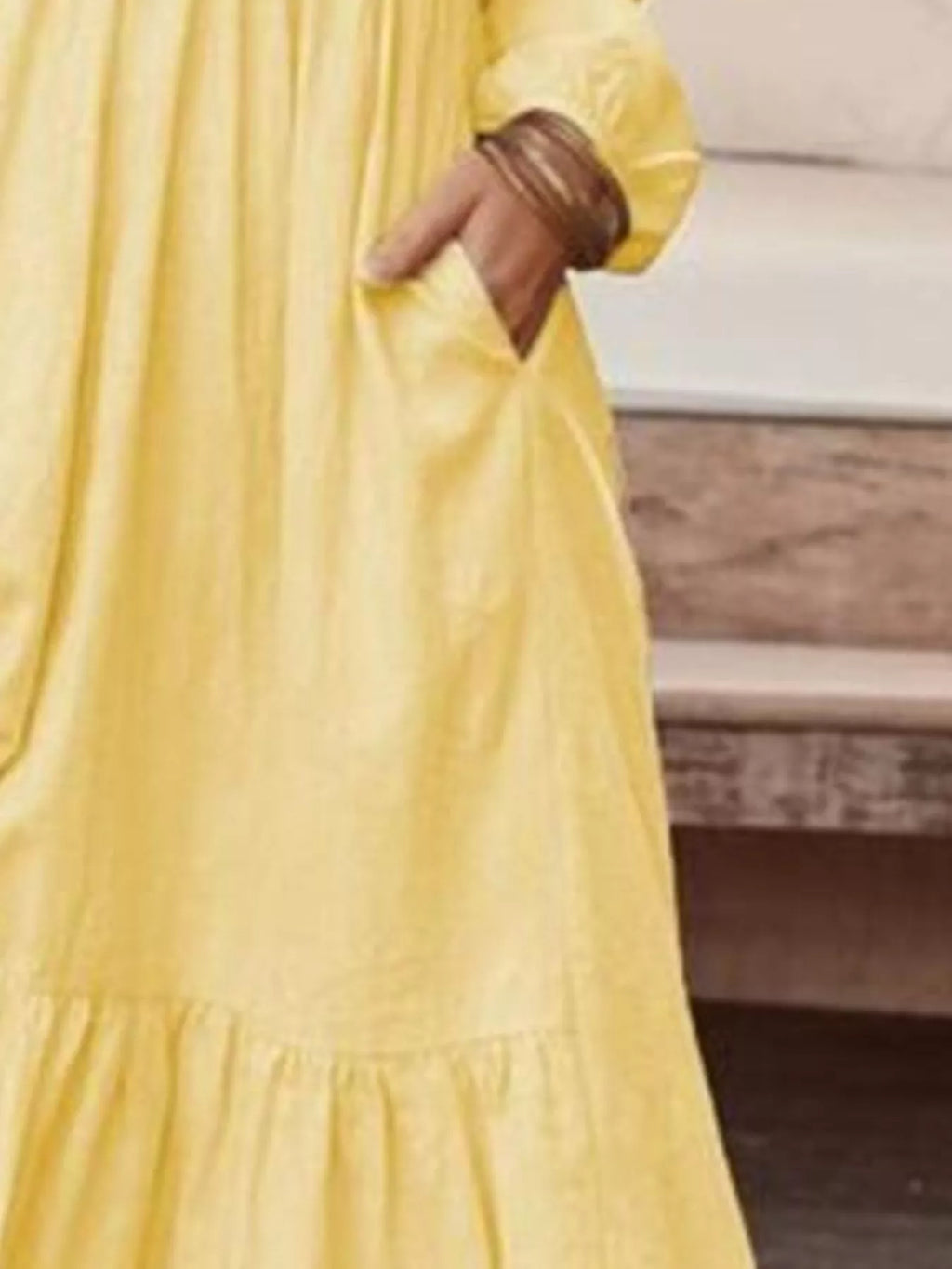 Plus size V-neck long sleeve tiered maxi dress with pockets by Trendsi, featuring a flowing silhouette and comfortable fit.