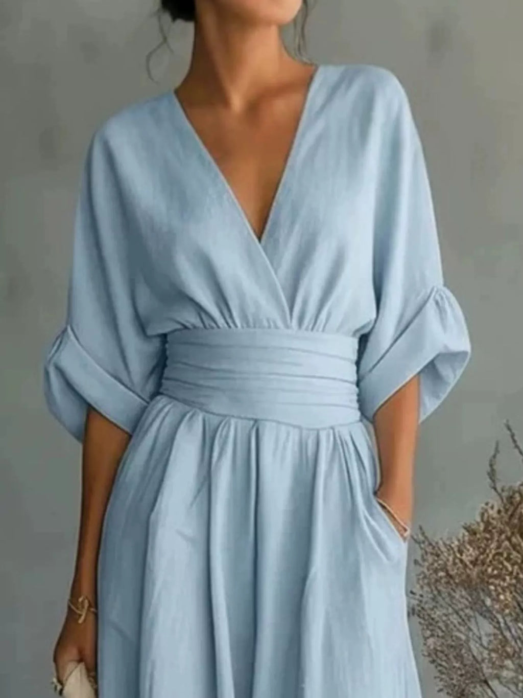 Plus size full size half sleeve wide-leg jumpsuit by Trendsi, featuring a stylish design with a relaxed fit and comfortable fabric.