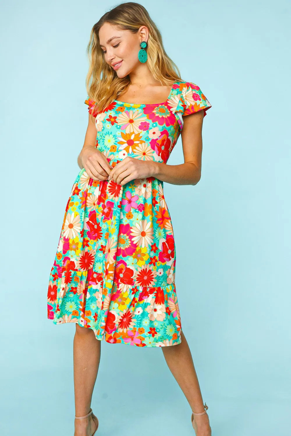 Haptics Floral Square Neck Short Sleeve Dress by Trendsi featuring a fitted bodice, vibrant floral pattern, and short sleeves.