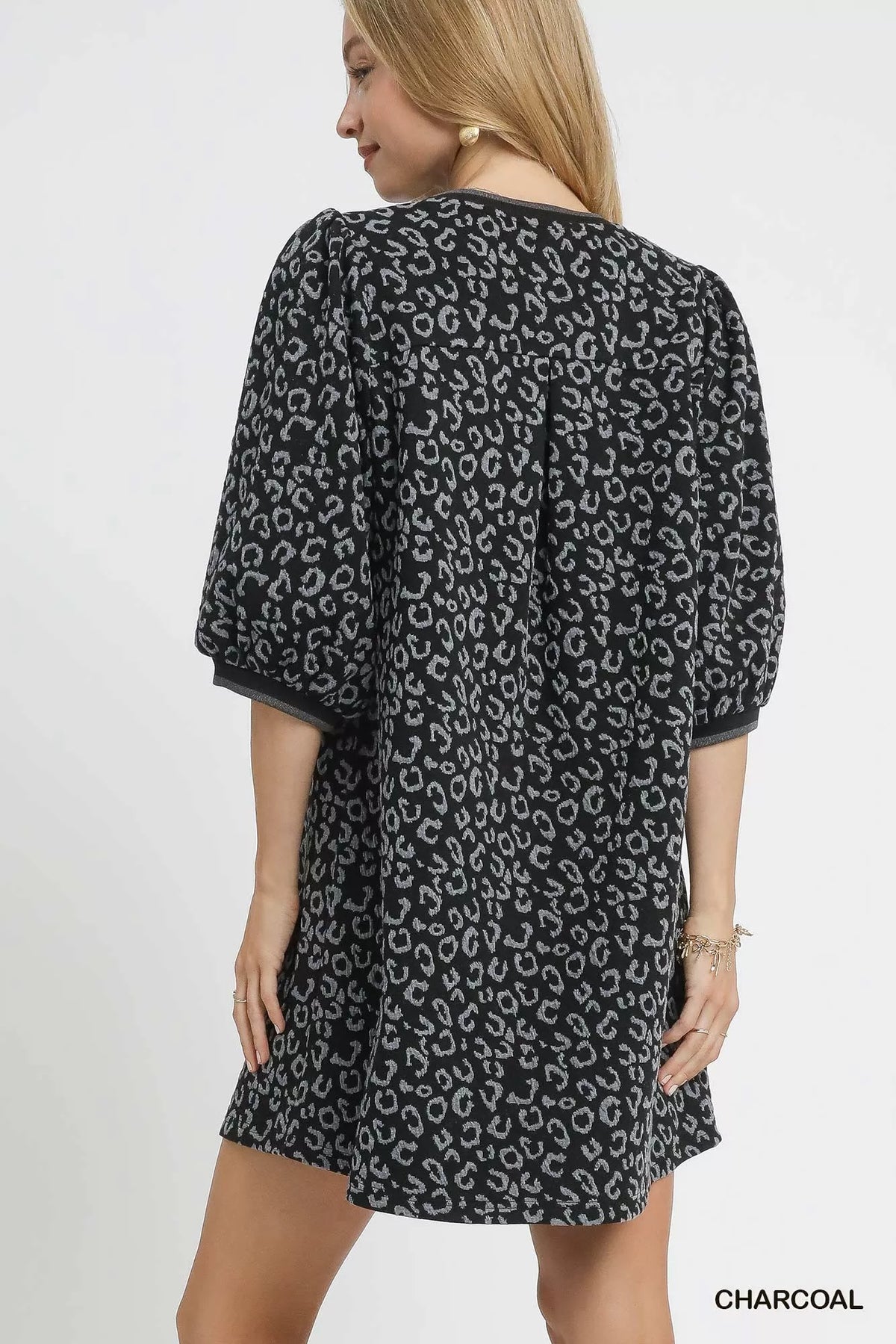 Umgee leopard print jacquard mini dress featuring a fitted silhouette and stylish design, perfect for casual or dressy occasions.